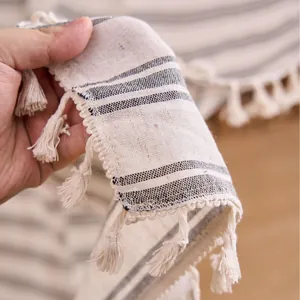 Close-up of French style striped curtain fabric with elegant tassel fringe details