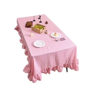 Elegant pink striped tablecloth with ruffled edges and non-slip fabric on white background