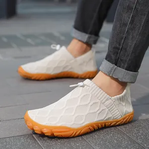 Breathable men's fly-knit casual shoes with slip-on toggle and orange rubber sole.