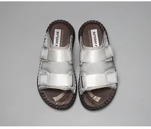 Top view of casual summer beach sandals featuring adjustable grey velcro straps