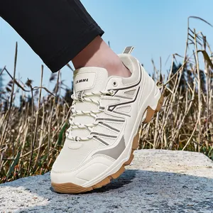 Beige outdoor hiking shoes with breathable mesh and rugged brown rubber soles