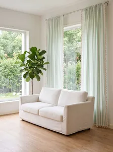Elegant light green striped sheer cotton linen curtains with decorative tassel trim detail
