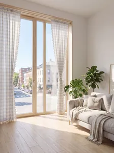 Detail view of striped curtains with tassels in a bright minimalist living room