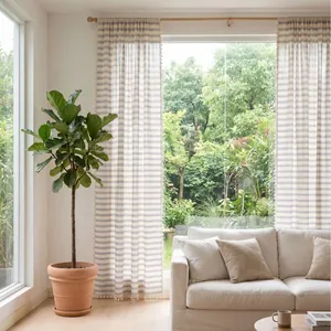 French style navy blue striped sheer curtains with tassels in a bright living room setup.