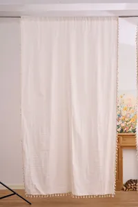 Tenda in cotone e lino color crema con nappe eleganti
