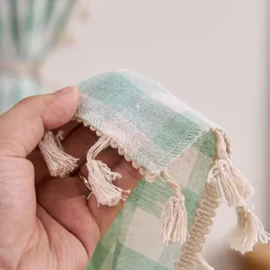 Sage green checkered cotton linen curtain featuring elegant handmade tassels for home decor.
