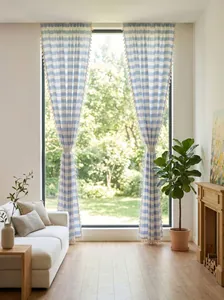 Blue and white checkered tassels curtains in a bright sunlit living room setting.