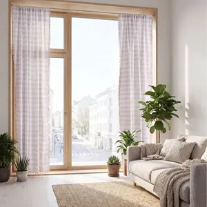 Elegant blue and white striped curtains with tassel trim in a minimalist sunlit living room