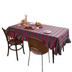 Red and green striped velvet tablecloth with elegant ruffled edges for rectangular dining tables
