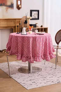 Macro view of French vintage red and white checkered round tablecloth with ruffled hem