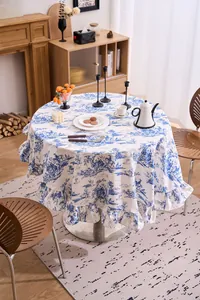 Detail view of vintage blue print round tablecloth with elegant ruffled edge design.