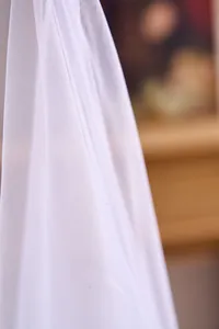 Close-up of fine white mesh tulle fabric texture for elegant wedding backdrop decorations
