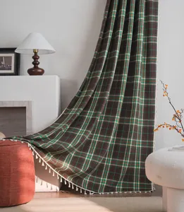 Cozy French style wool plaid curtain with tassels in a warm home interior setting