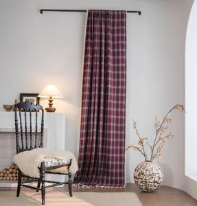 Detail view of French style red plaid wool-textured curtain with delicate tassel trim decoration