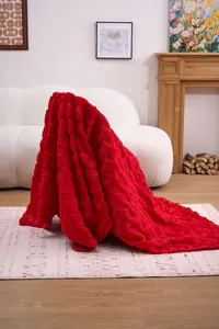Luxurious red plush blanket with carved texture detail for cozy Christmas home decor
