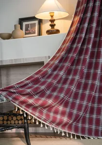 French style burgundy plaid curtain with white tassel fringe in a cozy home setting