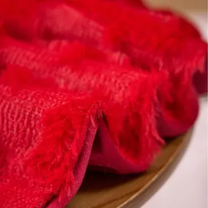 Premium red plush blanket with carved texture detail for cozy home and holiday decor