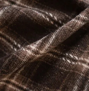 Macro detail of coffee and white plaid yarn-dyed fabric texture for curtains