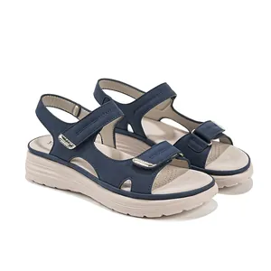 Navy blue sporty women's sandals with adjustable Velcro straps and thick sole