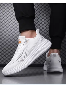 Detail view of white breathable mesh running shoes with stylish silver accents for men.
