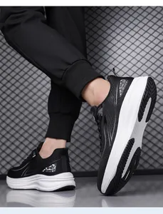 Macro detail of men's breathable black mesh running shoes featuring a thick white cushioned sole