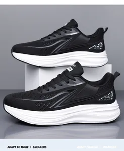 Detail of breathable black mesh men's running shoes with thick white cushioned soles.