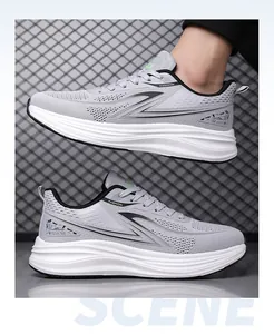 Detailed side view of grey breathable mesh running shoes featuring soft cushioned white soles