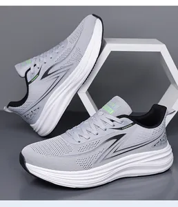 Side profile of grey breathable mesh running shoes featuring cushioned white soles
