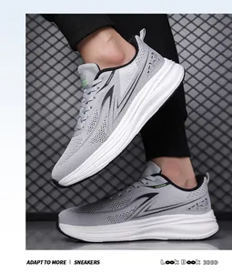 Detailed view of grey breathable mesh sneakers for men with shock-absorbing soles