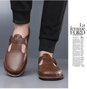 Detail shot of brown leather men's sandals with retro buckle and soft sole design.