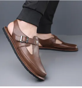 Detailed view of men's vintage brown leather sandals with adjustable buckle strap