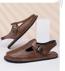 Macro detail of retro brown men's sandals featuring adjustable metal buckle and textured leather