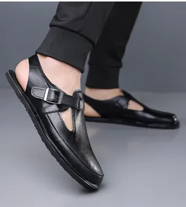 Detail view of men's black leather sandals with adjustable buckle and soft sole