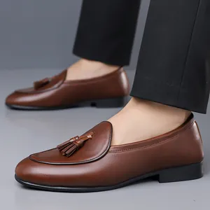 Elegant brown leather men's tassel loafers with a stylish British slip-on design