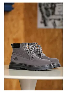 Grey suede men's work boots featuring lace-up design and thick rubber soles.