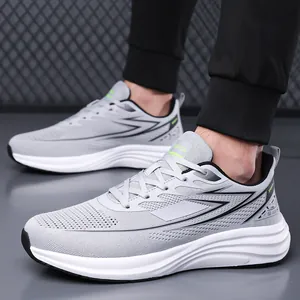 Lightweight grey fly-knit running shoes for men with breathable mesh design.
