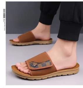 Detailed view of men's casual brown slide sandals featuring a checkerboard pattern strap