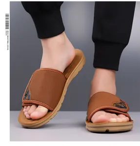Macro view of brown men's casual slides featuring checkerboard pattern and soft sole