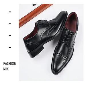 Detailed view of black British brogue business shoes with classic carved patterns