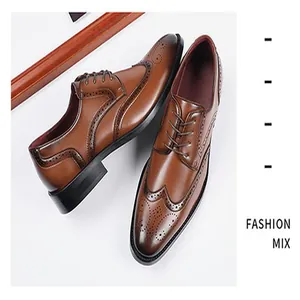 Close-up of tan men's brogue dress shoes with wingtip perforated details