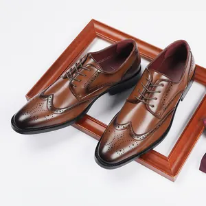 Classic brown leather brogue shoes with wingtip detailing in a professional setting