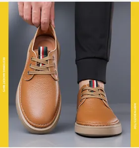 Detailed view of brown leather men's casual shoes with textured finish and lace-up design