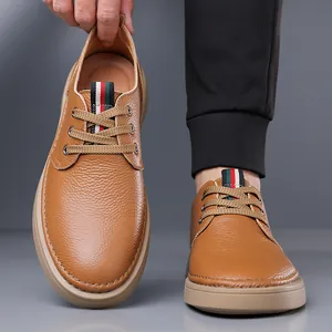 Men's textured brown leather casual shoes with classic striped webbing and soft soles.