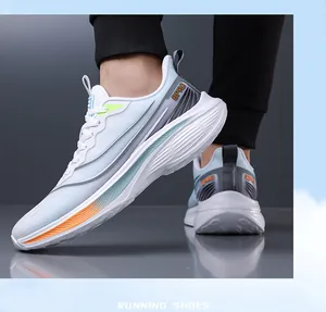 Close-up detail of lightweight white mesh running shoes for men with vibrant orange accents