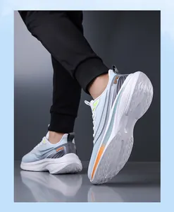 Detailed view of men's breathable mesh sports shoes in white and light blue colors