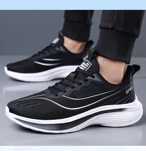 Detail view of black breathable mesh men's sneakers with lightweight white sole