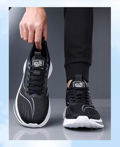 Detailed macro view of breathable black mesh men's sports sneakers with durable white sole