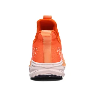 Back view detail of breathable orange mesh running shoe with heel pull tab and wave sole