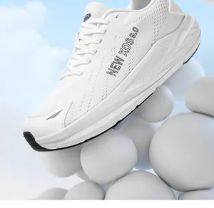 Close-up macro view of a breathable white mesh running shoe with NEW XOS branding