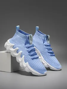 Men's light blue breathable fly-knit sneakers with wavy white sole sock-style design.